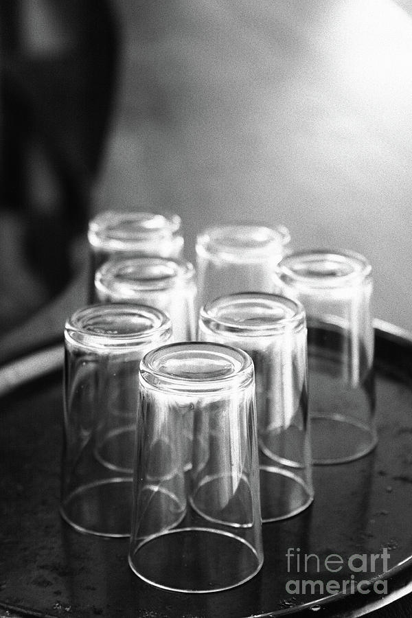 Glasses in a bar Photograph by Gaspar Avila