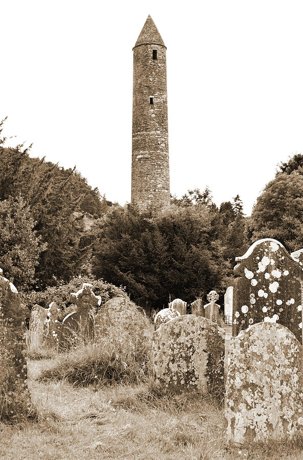 Glendalough Irish Round Tower Above Graveyard Headstones County Wicklow Ireland Sepia Photograph by Shawn OBrien