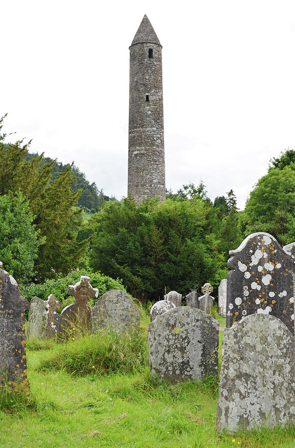 Glendalough Irish Round Tower Above Graveyard Headstones County Wicklow Ireland Photograph by Shawn OBrien