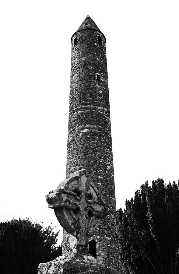 Glendalough Irish Round Tower Behind Celtic Cross County Wicklow Ireland Black and White Photograph by Shawn OBrien