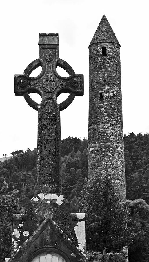Glendalough Irish Round Tower Beside Celtic High Cross County Wicklow Ireland Black and White Photograph by Shawn OBrien