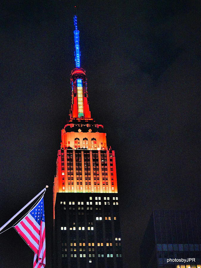 Glowing Empire State Building with American Flag Photograph by Jack Riordan