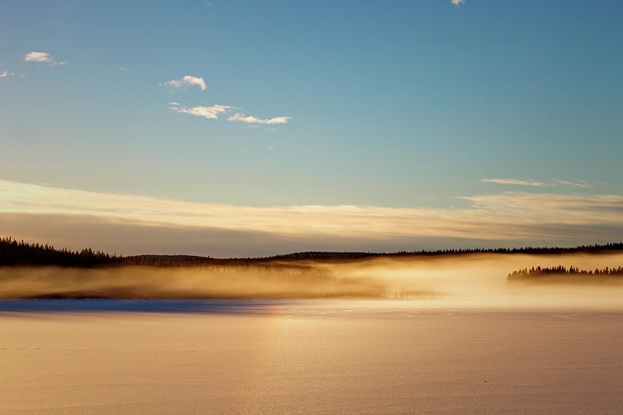 Glowing mists are rising from a frozen lake Photograph by Ulrich Kunst And Bettina Scheidulin