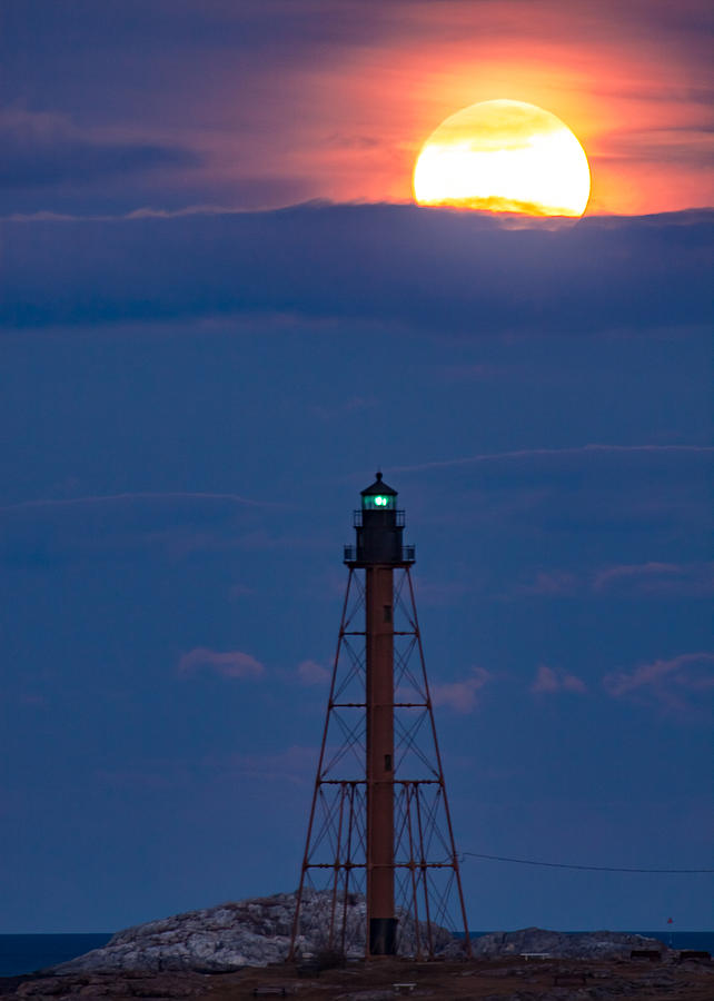 Glowing moon rises over Marblehead Light Digital Art by Jeff Folger
