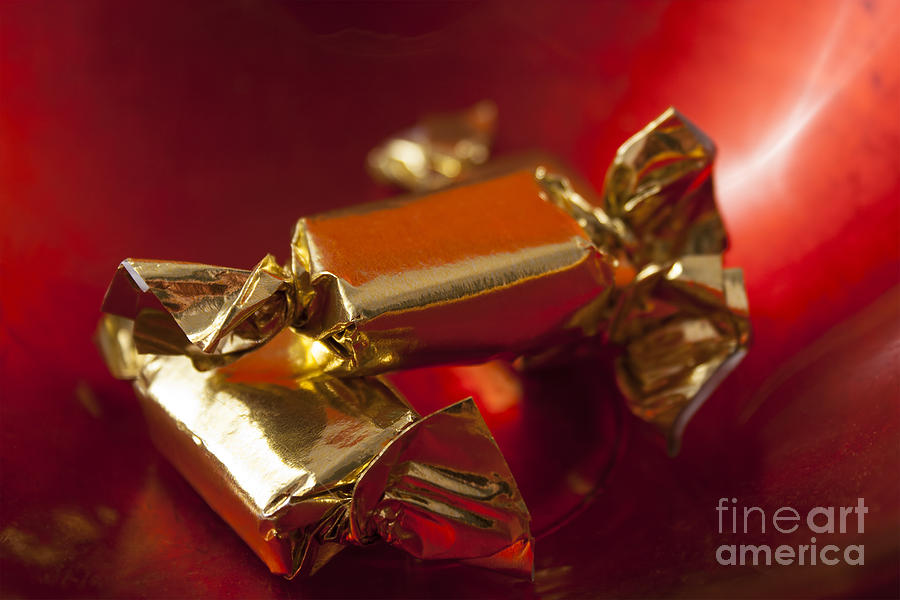 Gold foil sweets Photograph by Sophie McAulay