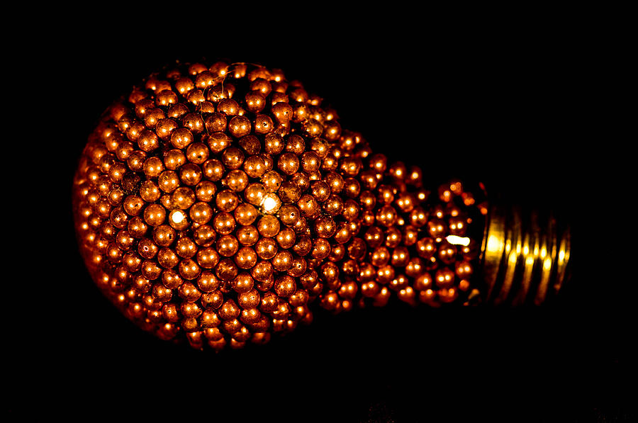 Gold light bulb Photograph by Gerald Kloss