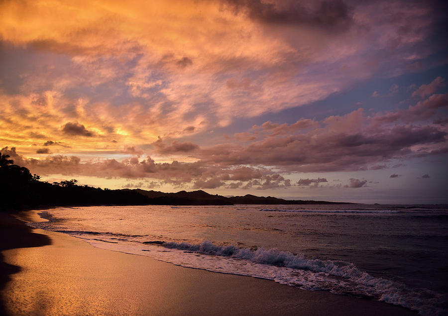 Sunset Photograph - Golden clouds at sunset reflecting off wet beach sand Maimon Bay by Reimar Gaertner