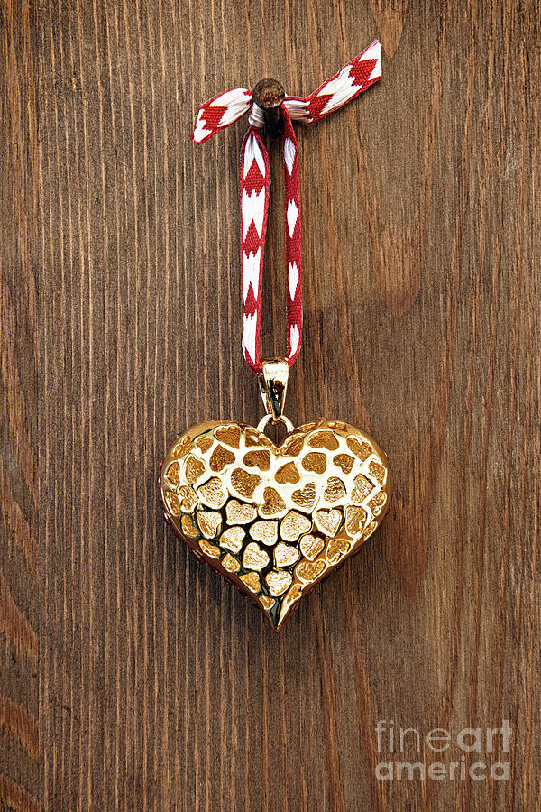 Golden Heart On Wooden Background Photograph