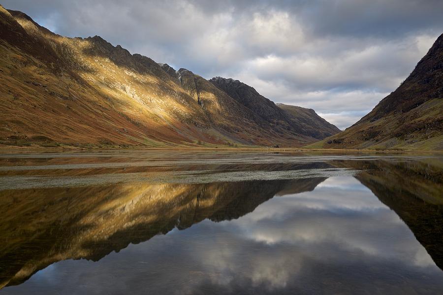Golden Light and reflections in Glencoe Photograph by Stephen Taylor