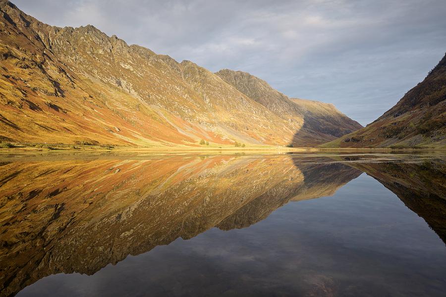 Golden light and still waters at Loch Achtocitan Photograph by Stephen Taylor