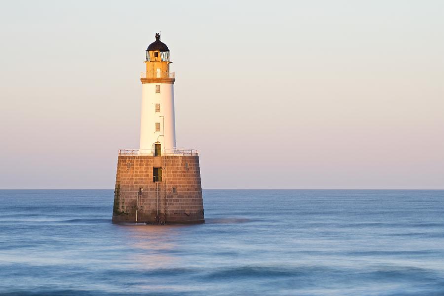 Golden Light hits the Rattray Head Lighthouse Photograph by Stephen Taylor