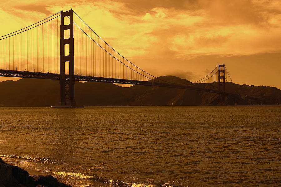Golden skies over the Golden Gate Bridge Photograph by Aidan Moran