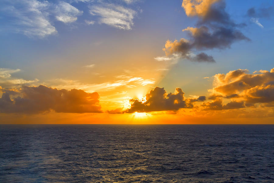 Golden Sunset at Sea Photograph by Bill and Linda Tiepelman