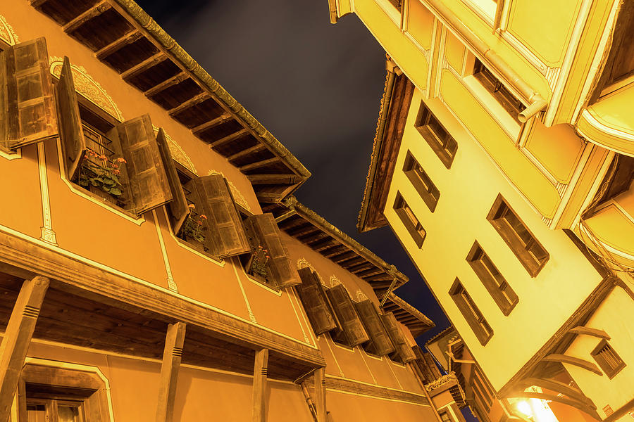 Golden Yellow Night - Chic Zigzags of Oriel Windows and Serrated Roof Lines Photograph by Georgia Mizuleva