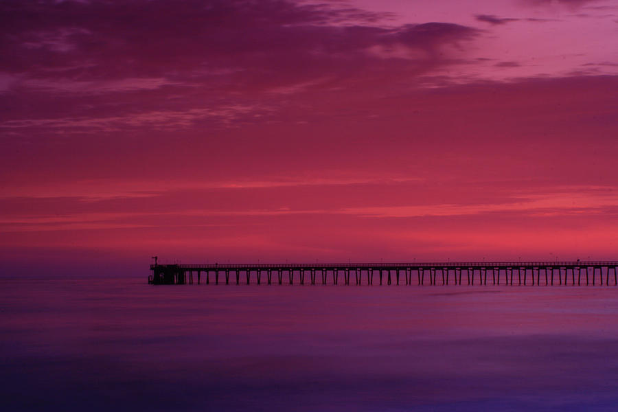 Goleta Pier at Sunset Photograph by Roger Mullenhour