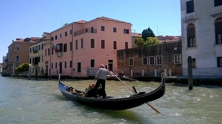 Gondolier on the Grand Canal  Venice Photograph by Rusty Gladdish