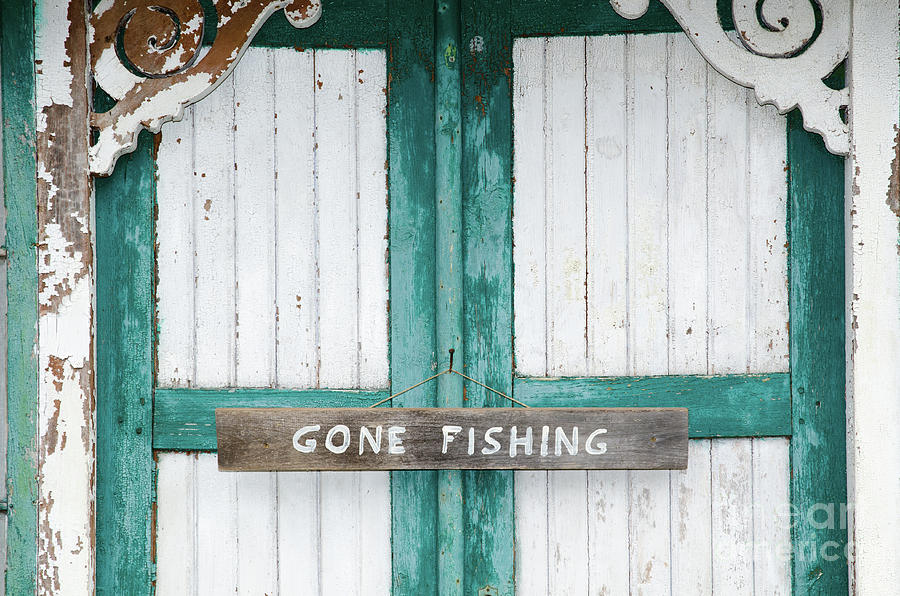Gone Fishing Sign At Weathered Doors Photograph
