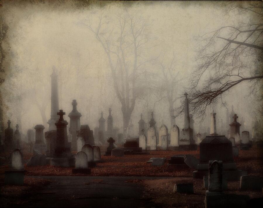 a haunting desktop wallpaper featuring a ghostly figure standing in a  deserted graveyard with mist and fog --ar 16:9