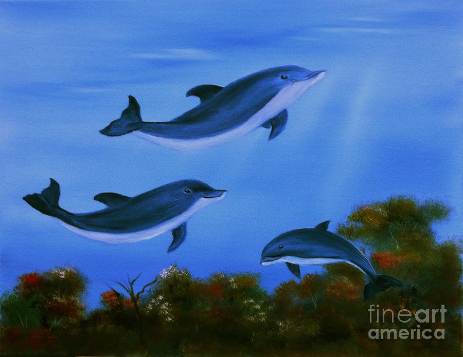 Graceful Dolphins at play. by Cynthia Adams