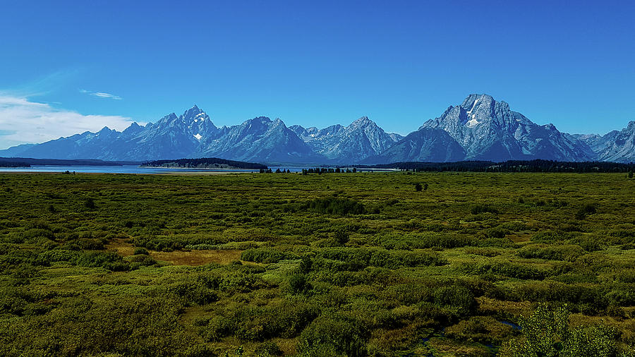 Grand Teton Mountains with Distant Lake Photograph by Marilyn Burton