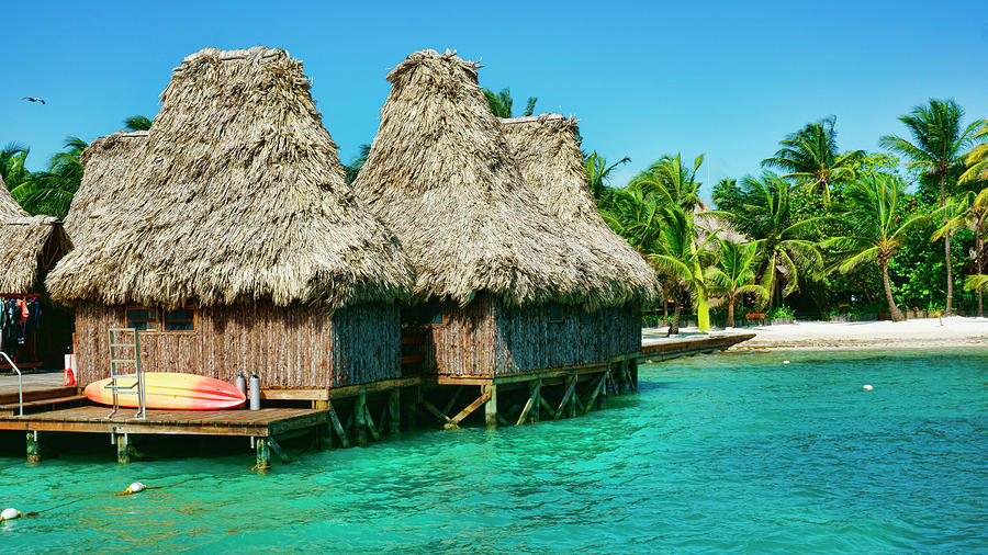 Grass Huts on the water of Ambergris Caye Belize Photograph by Waterdancer