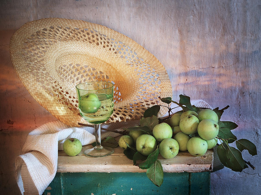 Still Life Photograph - Green Apples and Straw Hat by Nikolay Panov