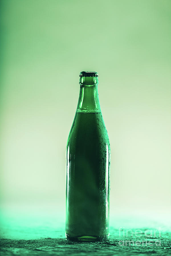 Green beer bottle. St. Patricks Day Photograph by Michal Bednarek