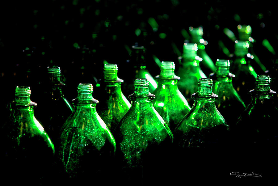 Green Bottles In The Dark With Strong Lighting Photograph by Dan Barba