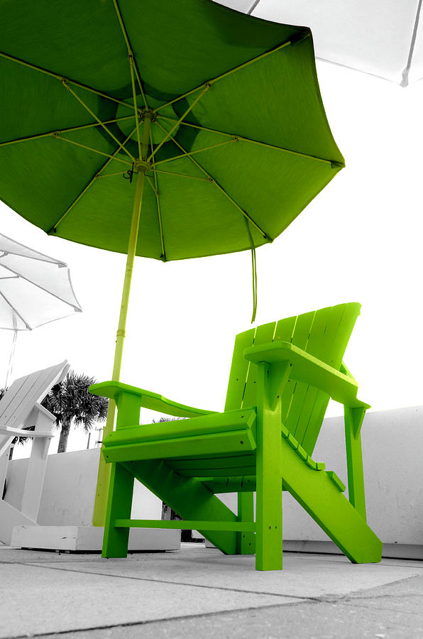 Green chair and umbrella Photograph by Wolfgang Stocker