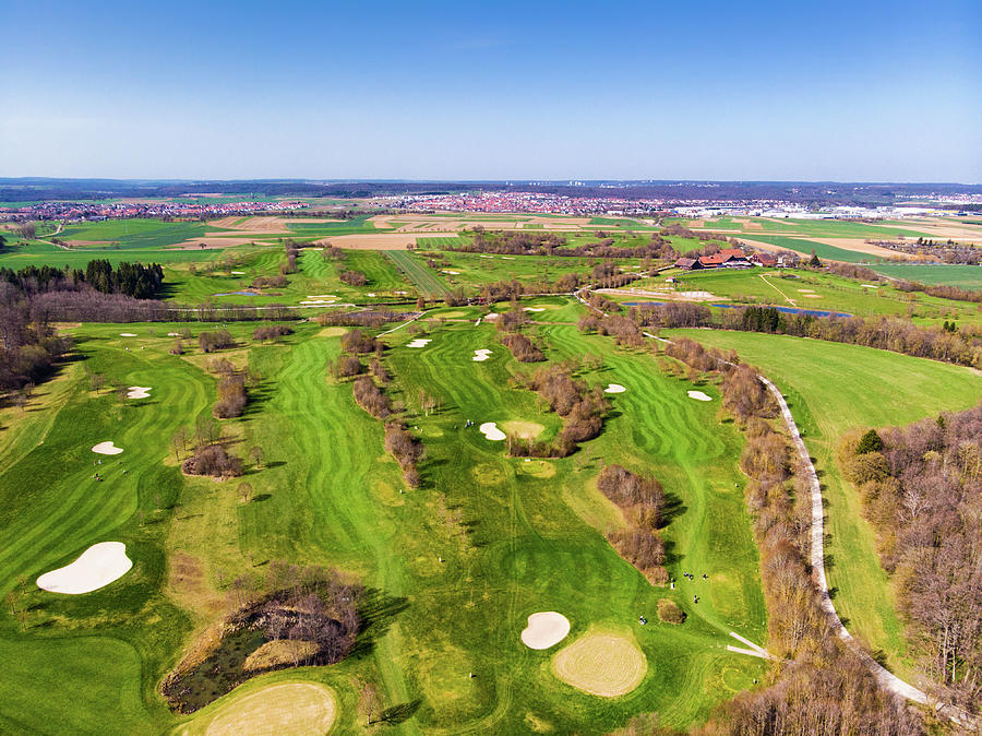 Green golf course aerial view Photograph by Matthias Hauser