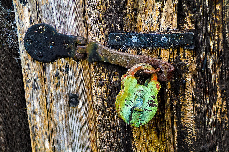 Green lock on an old shed door. Photograph by John Paul Cullen
