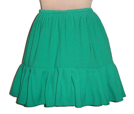 Skirt Photograph - Green mini skirt with ruffle. Ameynra fashion for teens by Sofia Goldberg