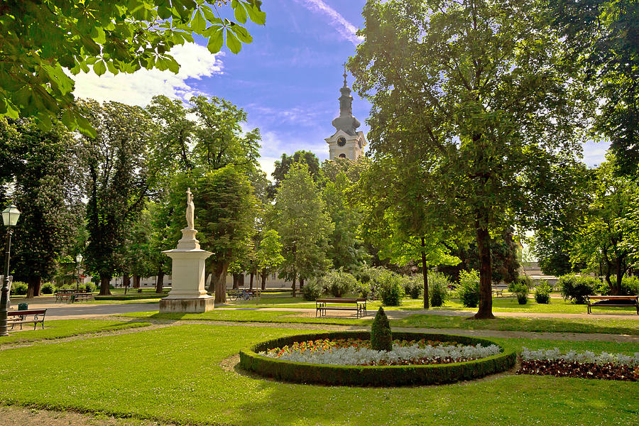 Green park and church in Bjelovar Photograph by Brch Photography