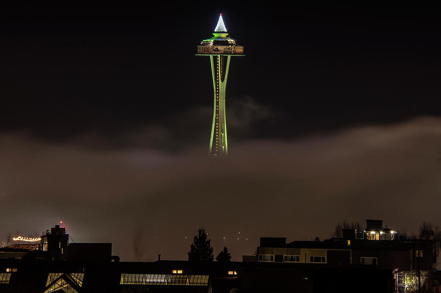 Green Space Needle Rising Out Of The Fog Photograph by Matt McDonald
