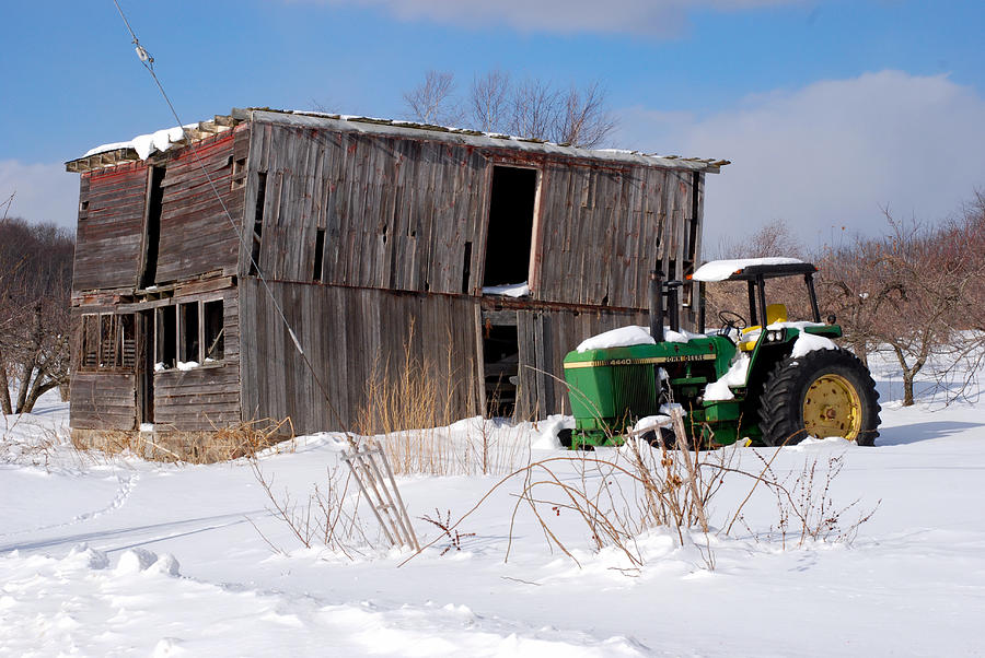 Green Tractor in Snow Photograph by Andrea Simon