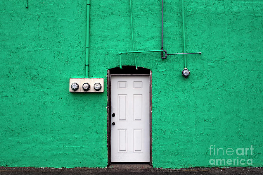 Green Wall with White Door with utility meters Photograph by Jim Corwin