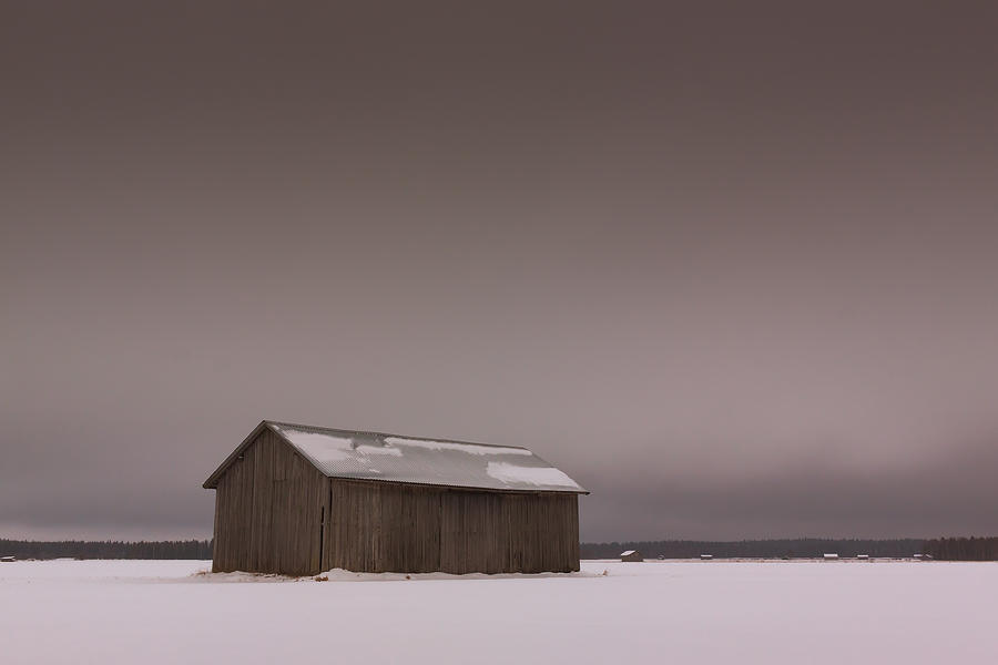Architecture Photograph - Grey Skies Over The Winter Fields by Jukka Heinovirta