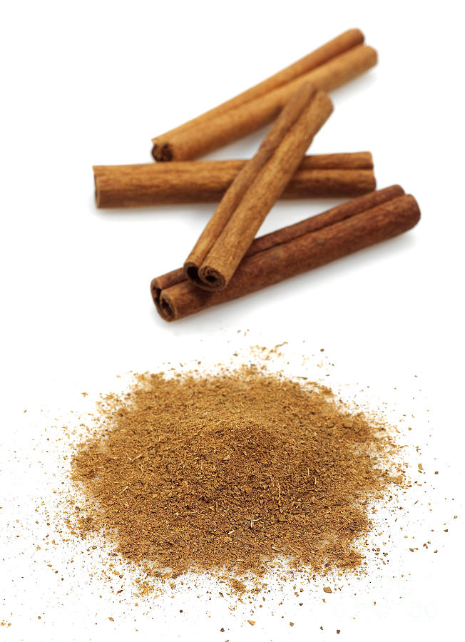Ground Cinnamon And Cinnamon Sticks Photograph by Gerard Lacz