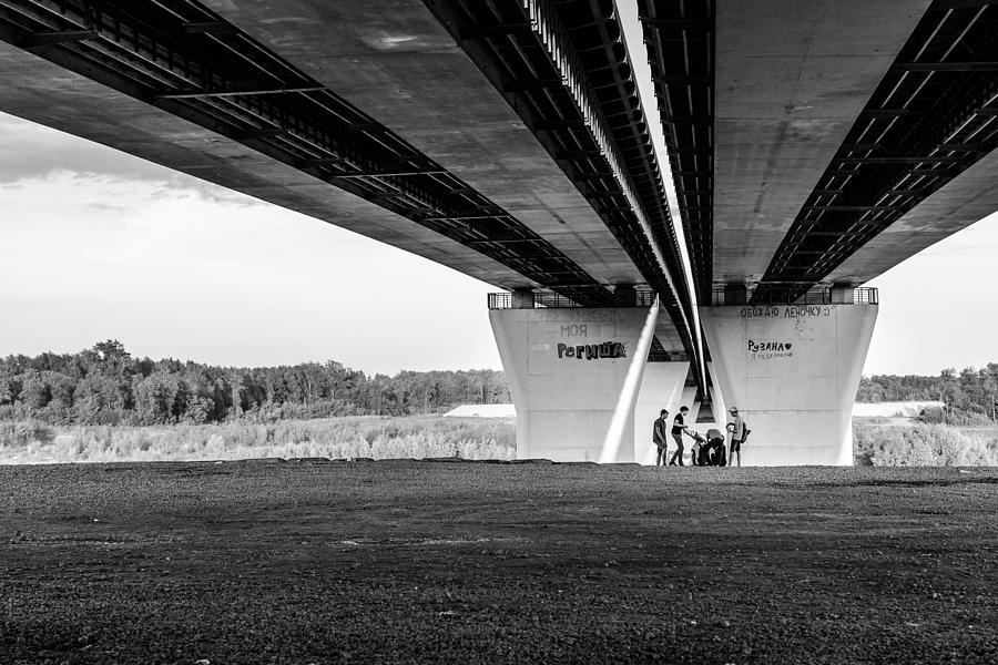 Group of Children Playing Under a Bridge Photograph by John Williams