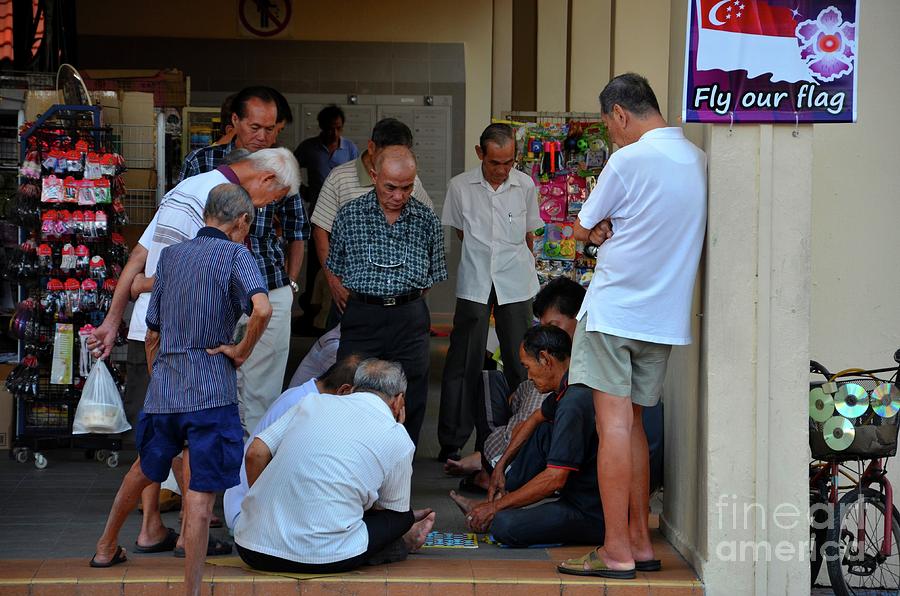 Group of Chinese men watch a game of checkers in Singapore neighborhood Photograph by Imran Ahmed
