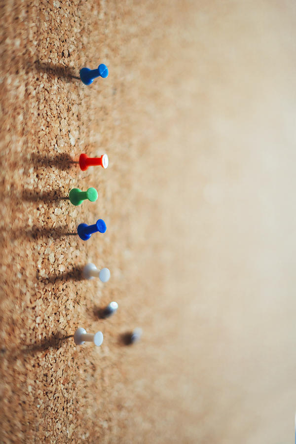 Group of thumbtacks pinned on corkboard. Texture background Photograph ...