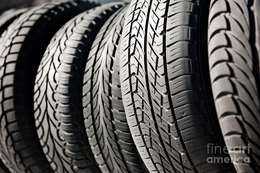 Group of used black tires in row  Photograph by Arletta Cwalina