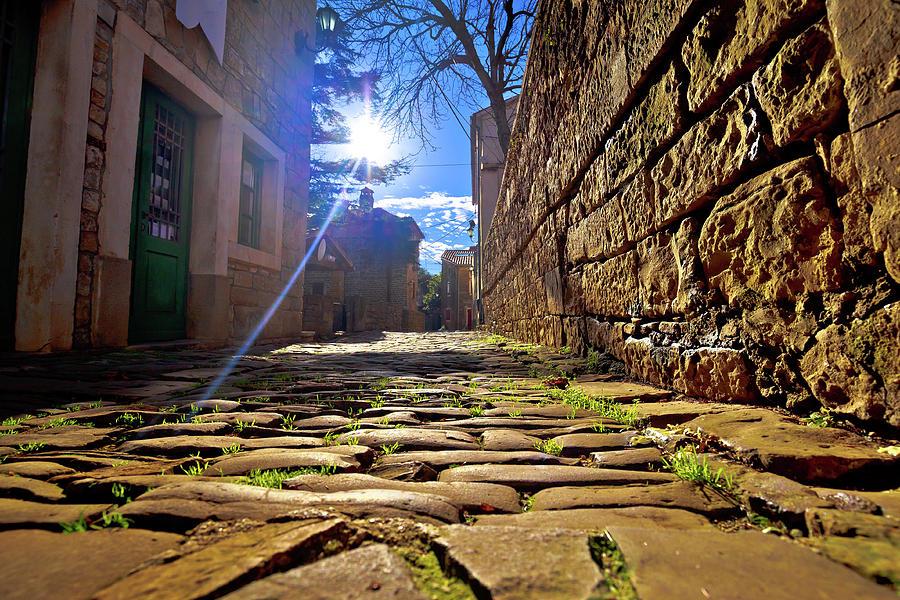 Groznjan cobbled street and old architecture at sunset view Photograph by Brch Photography