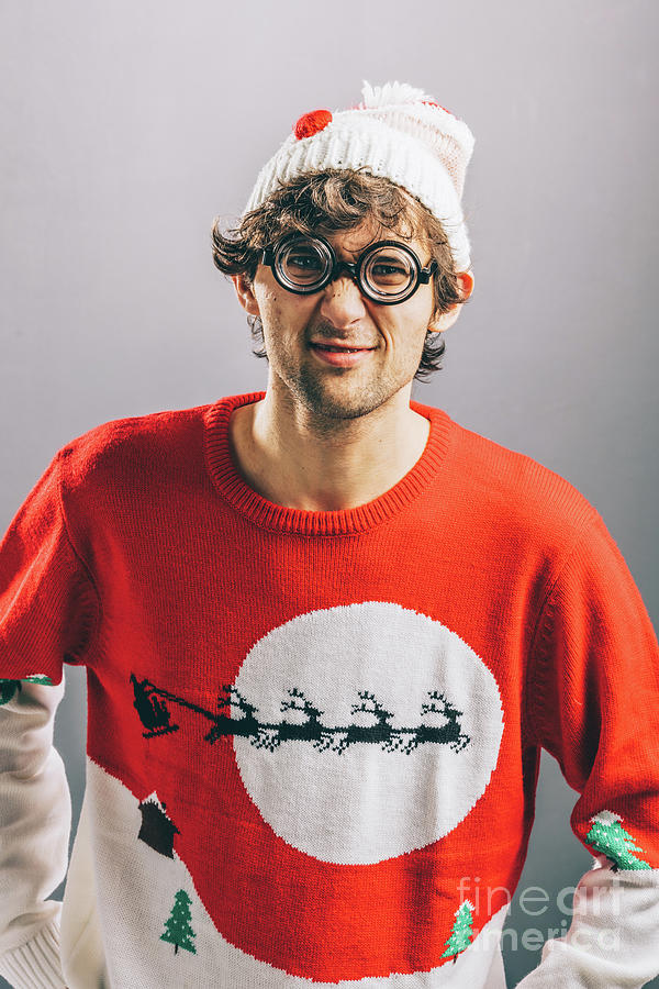 Christmas Photograph - Grumpy man in funny christmas clothes and glasses. by Michal Bednarek