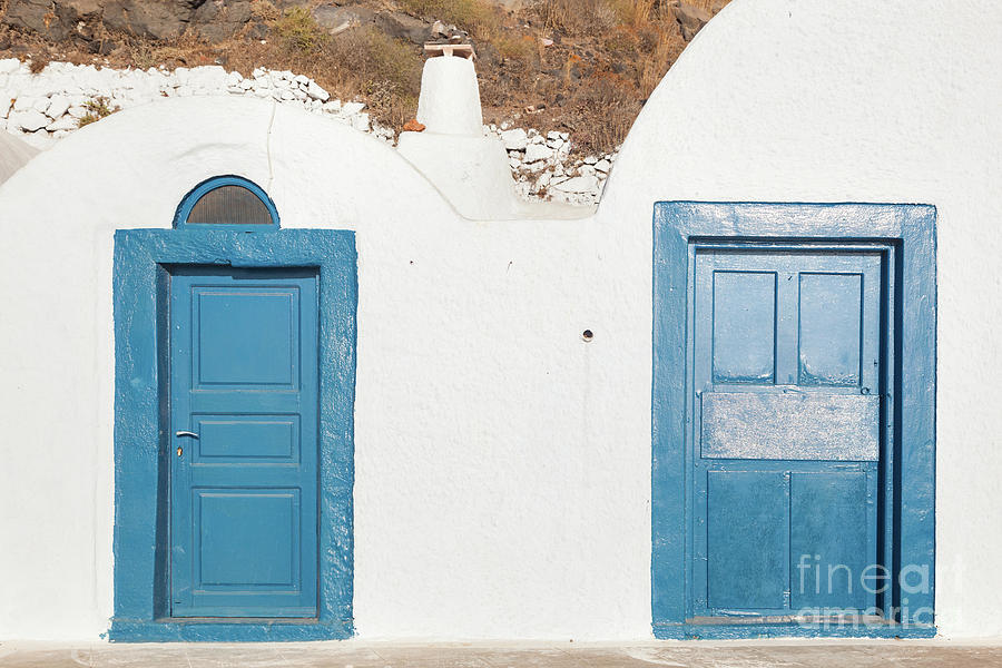 Grunge old blue doors in Oia town, Santorini, Greece. Photograph by Michal Bednarek
