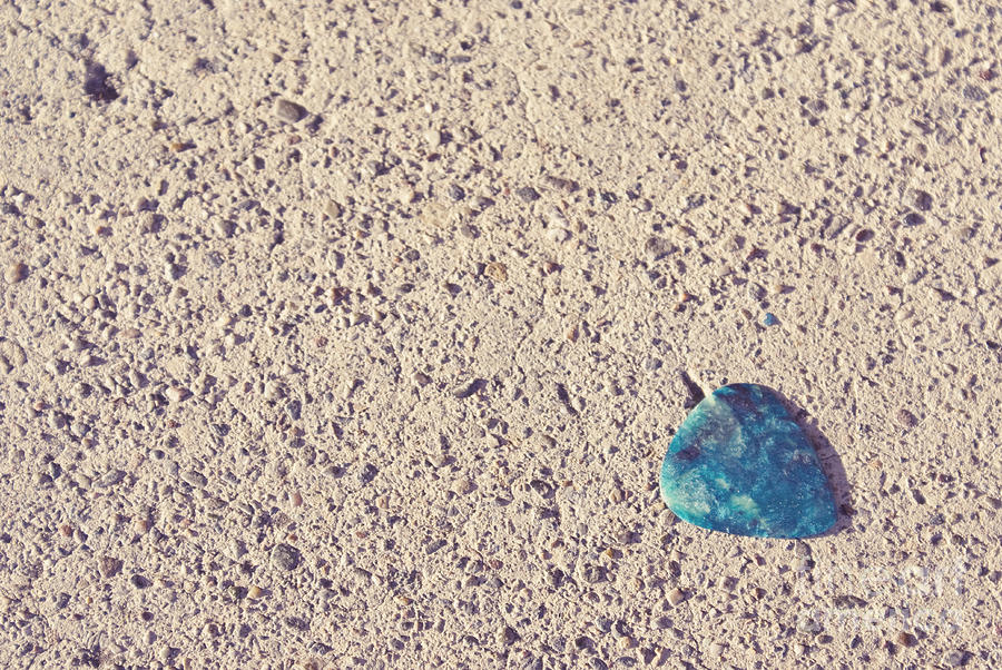 Guitar pick on sidewalk Photograph by Cindy Garber Iverson