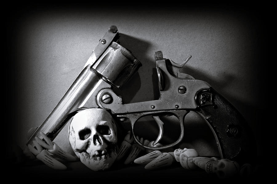 Gun and Skull Photograph by Scott Wyatt