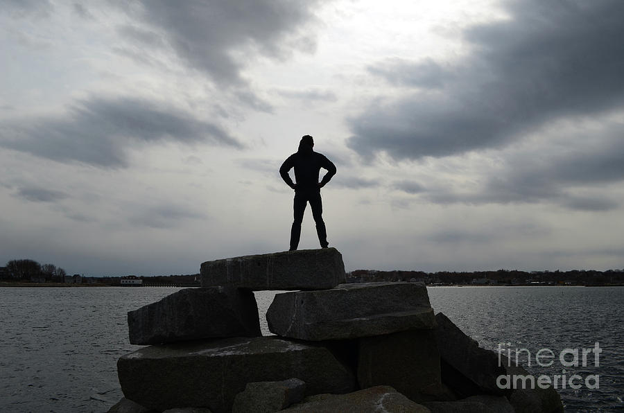 Guy Silhouetted in a Super Hero Pose on a Rock Jetty Photograph by DejaVu Designs