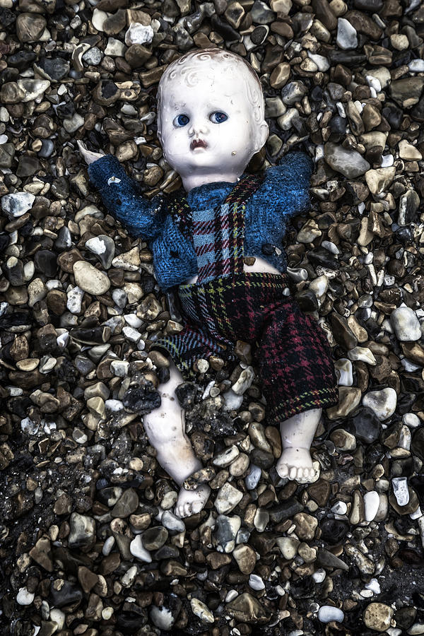 Pebbles Photograph - Half Buried Doll by Joana Kruse