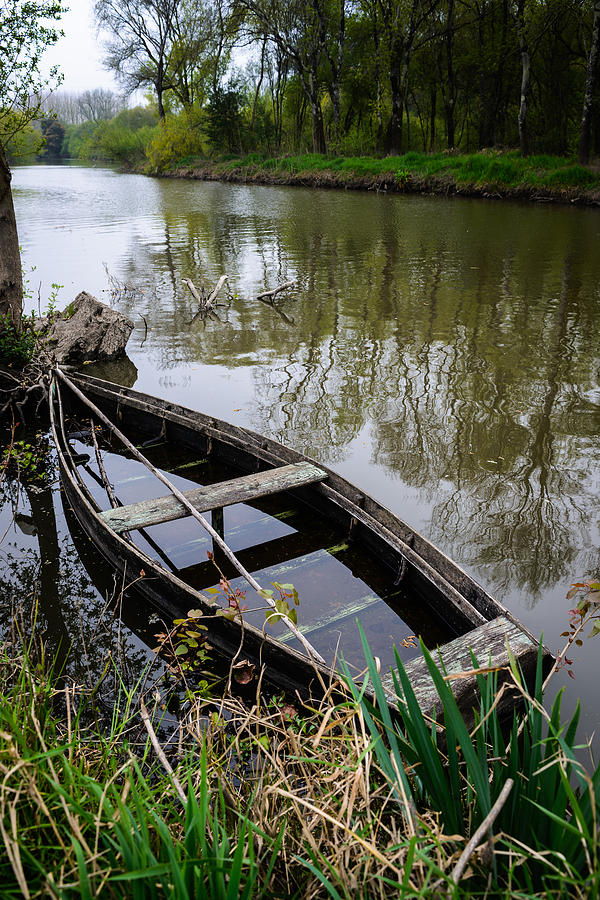 Half Sunken Rowboat Photograph by Marco Oliveira